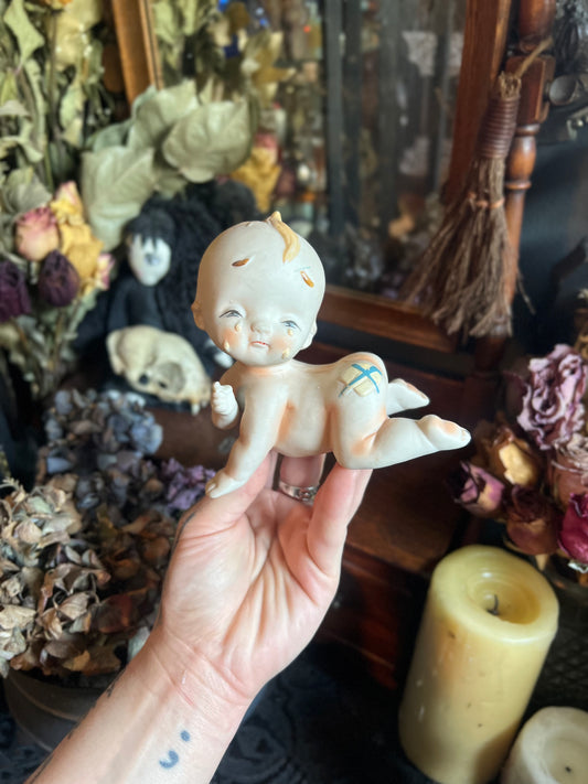 Crying Kewpie Figurine